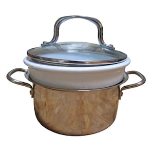 May include: A stainless steel cooking pot with a white enamel insert and a glass lid. The pot has two side handles and a curved handle on the lid. The pot is designed for cooking and steaming.