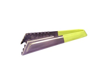 May include: A stainless steel ice tong with a yellow handle. The tong has a serrated edge for gripping ice.