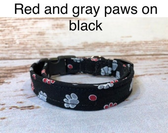 Red and gray paws on black dog collar, standard adjustable or martingale