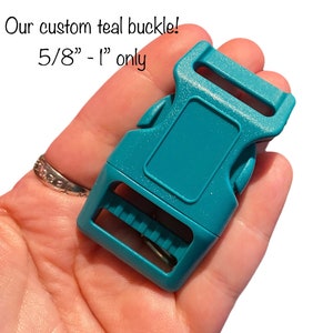 May include: Teal plastic buckle for dog collars or leashes. The buckle is 5/8" to 1" in size.