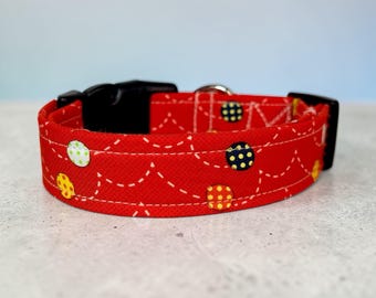 Bouncing Balls on Red handmade dog collar, adjustable side release, washable cotton fabric, webbing core, customizable hardware color