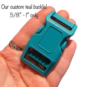 A hand holds a teal plastic buckle, with text "Our custom teal buckle! 5/8" - 1" only" above it.