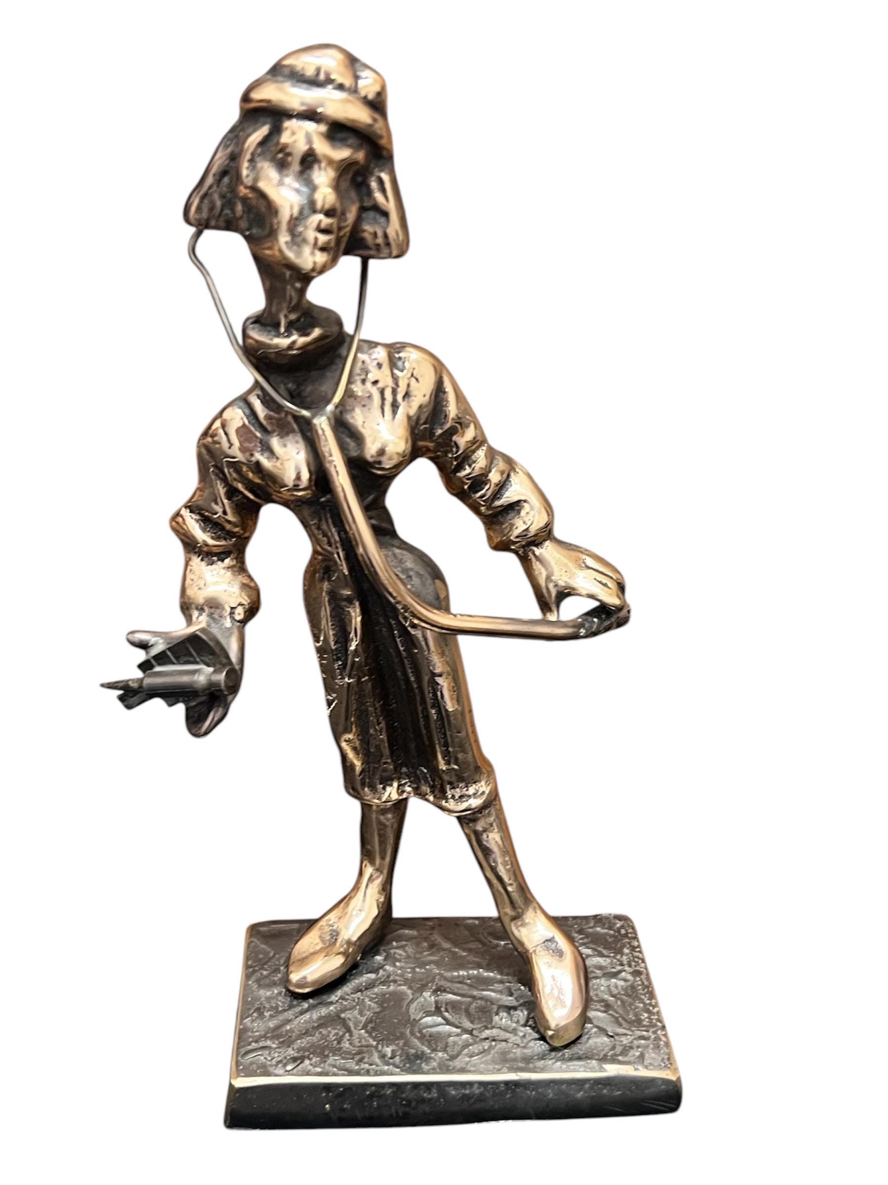 bronze sculpture of a medical professional created by Yves Lohe