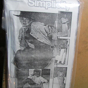 May include: A Simplicity sewing pattern envelope 6744 in a clear plastic sleeve. The white paper cover features black and white illustrations of various clothing combinations including a jacket, skirt, trousers, and top, with the text Simplicity 6744.