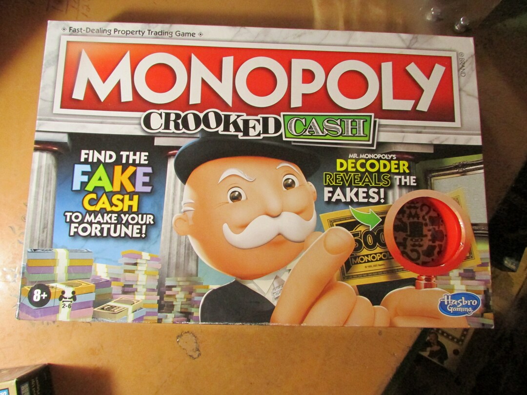Juego De Mesa Cocodrilo Sacamuelas Monopoly Juego De Mesa De Decodificador De Efectivo Para Familias Y Niños De 8 Años En Adelante, Incluye El Decodificador De Mr. Monopoly Para Encontrar Falsificaciones, Para