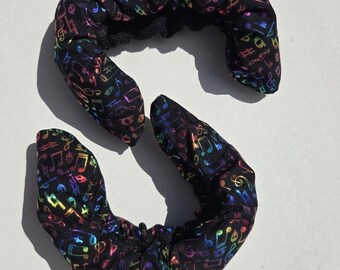 Figure skating soakers, rainbow musical notes