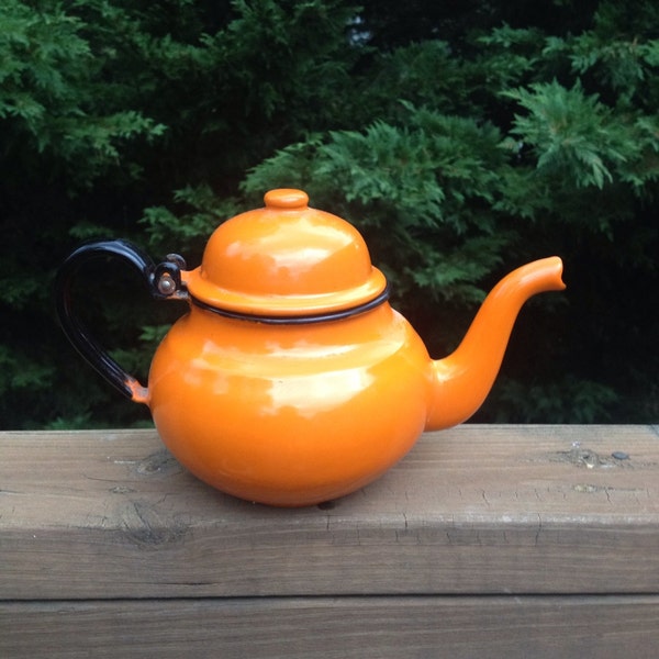 Vintage orange and black enamelware teapot