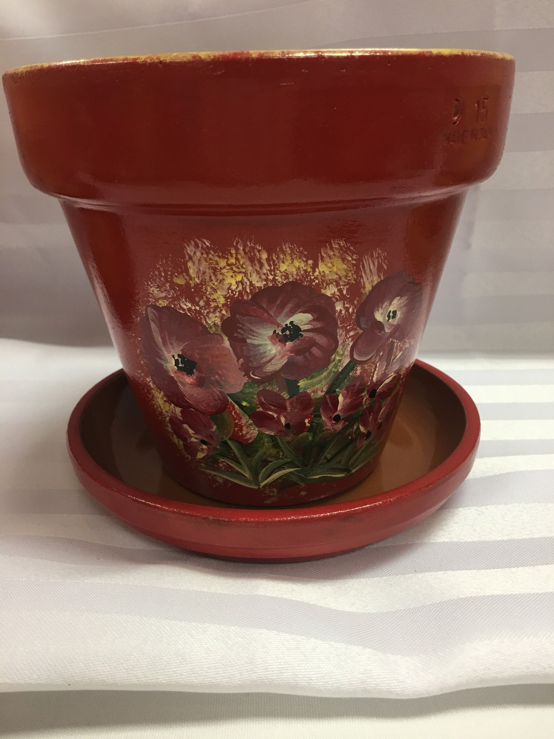 Red maroon floral design flower pot with matching saucer