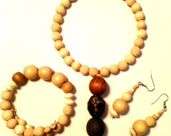 Bone Colored Flower Hangs from Assorted Light and Dark Wooden Beaded Adjustable Necklace with Earrings and Bracelet