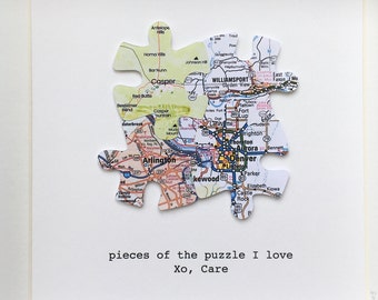 Puzzle piece family of FOUR paper jigsaw map framed art. Personalised travel journey gift.