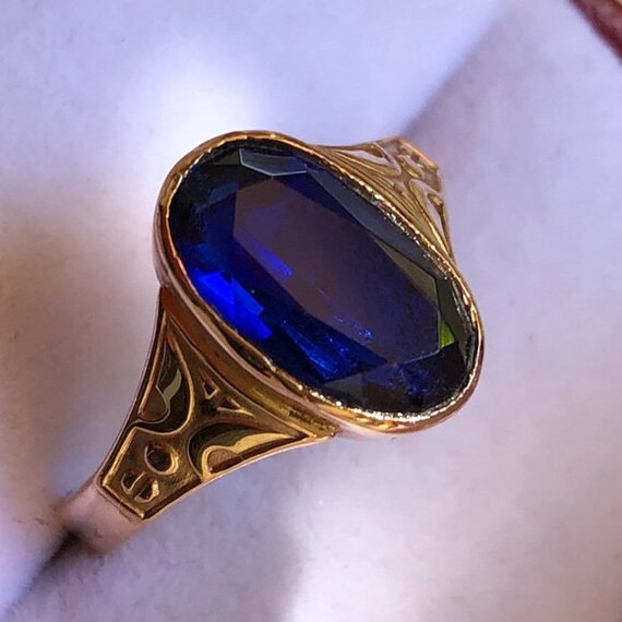 rose gold ring with blue stone