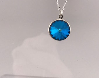 Swarovski crystal necklace: crystal bermuda blue rivoli pendant on a sterling silver gossamer chain