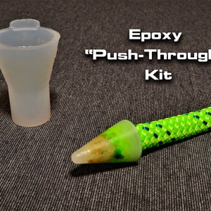 May include: Epoxy "Push-Through" Kit with a clear silicone mold and a green and blue rope with a green epoxy tip.