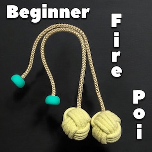 May include: Two yellow fire poi with teal handles and tan braided ropes. The poi are hanging from the ropes and the text "Beginner Fire Poi" is written in white letters on a black background.