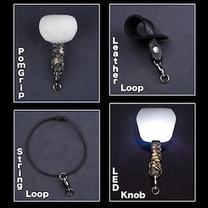 Puede incluir: Se muestran cuatro imágenes de productos. La parte superior izquierda muestra un pomgrip blanco con un asa trenzada. La parte superior derecha muestra un lazo de cuero negro. La parte inferior izquierda muestra un lazo de cuerda negro. La parte inferior derecha muestra un mando LED.