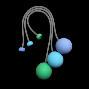 May include: A set of juggling balls in shades of blue and green, connected by gray cords. The balls are round and have a matte finish. The background is black.