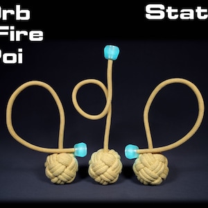 May include: Three tan coloured fire poi with blue glow sticks attached to the ends of the ropes. The poi are arranged in a static position with the ropes forming a figure eight shape. The text "Orb Fire Poi" is in the top left corner of the image and the text "Static Kevlar" is in the top right corner of the image.