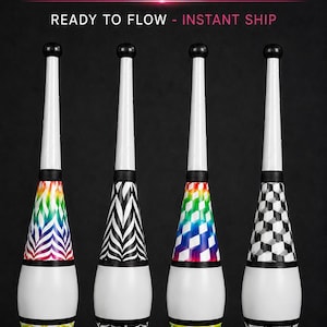 May include: Four juggling clubs with white handles and black knobs. The bodies feature distinct patterns: rainbow zebra stripes, black and white zebra stripes, rainbow cubes, and black and white cubes. Text reads: LIMITED NOW AVAILABLE, READY TO FLOW - INSTANT SHIP, RAINBOW TRIBAL, BLACK TRIBAL, RAINBOW CUBE, MONO CUBE, FLOWONFIRE.ETSY.COM.