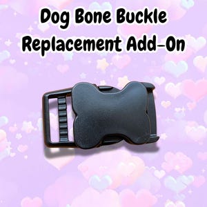 May include: A black dog bone buckle replacement add-on. The buckle is made of a durable material and features a bone-shaped design. The text "Dog Bone Buckle Replacement Add-On" is displayed in black font.