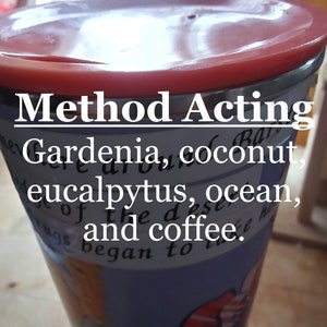 May include: A blue and white travel mug with a red lid. The mug has the text "Method Acting" and "Gardenia, coconut, eucalyptus, ocean, and coffee." printed on it.
