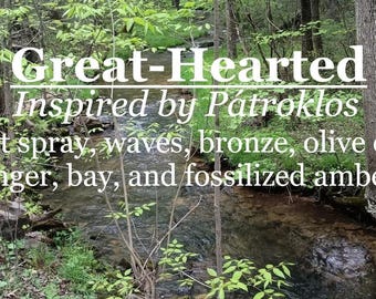 May include: A photo of a stream in a forest with the text "Great-Hearted Inspired by Pátroklos Salt spray, waves, bronze, olive oil, ginger, bay, and fossilized amber."