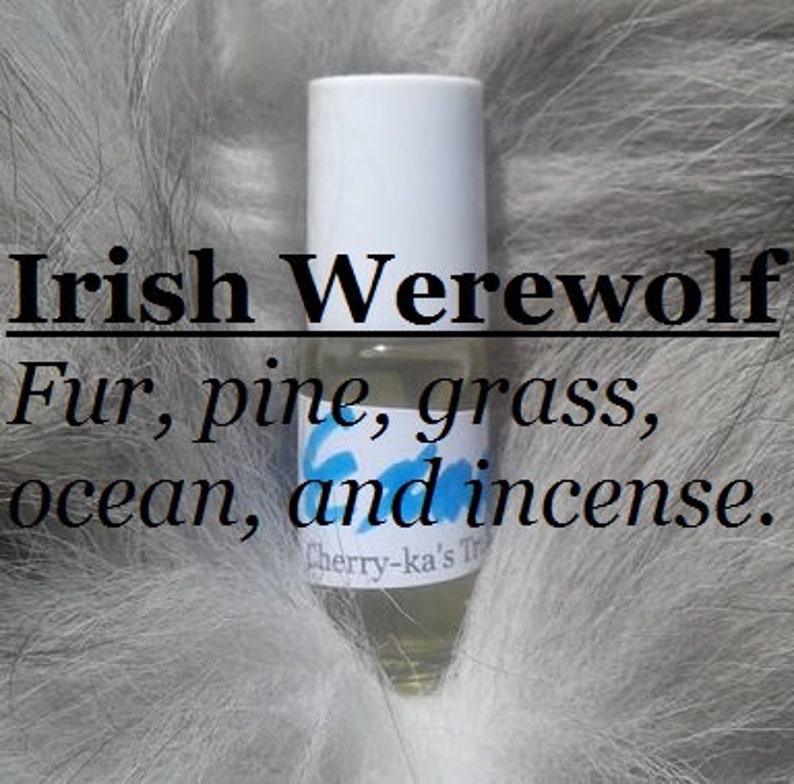 May include: A small glass bottle with a white cap and a light yellow liquid inside. The bottle is labeled "Irish Werewolf" and lists the scent notes as "Fur, pine, grass, ocean, and incense."