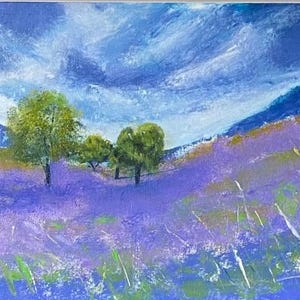 May include: An acrylic painting of a landscape featuring a field of lavender flowers under a cloudy blue sky. Green trees are scattered across the field and in the distance. The painting uses a palette of blues, purples, greens, and yellows.