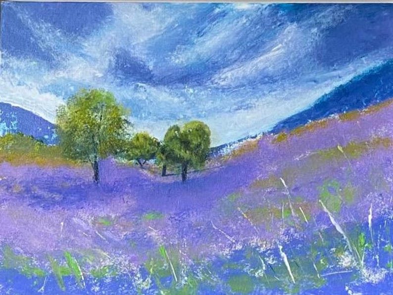 May include: An acrylic painting of a landscape featuring a field of lavender flowers under a cloudy blue sky. Green trees are scattered across the field and in the distance. The painting uses a palette of blues, purples, greens, and yellows.