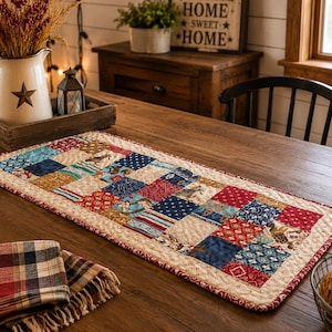 May include: A rectangular table runner featuring a patchwork design of various fabric squares in shades of red, blue, cream, and brown. The runner has a quilted texture with a decorative border and displays patterns including stars, stripes, and horses.