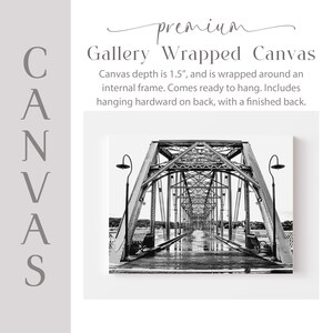 The image is a black and white photograph of a bridge with a textured surface, featuring a series of arches and trusses.