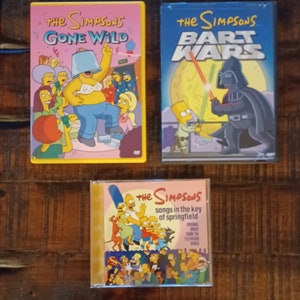 The Simpsons Dvds Gone Wild & Bart Wars Songs in the Key Of Springfield CD very good you pick