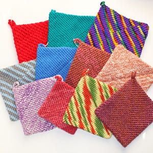 May include: A collection of ten crocheted pot holders in various colors and patterns, including red, blue, green, purple, and gray.