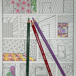 May include: Three colored pencils, green, red, and purple, are laid out on a coloring book page with a variety of geometric patterns. The pencils are Prismacolor Premier brand.