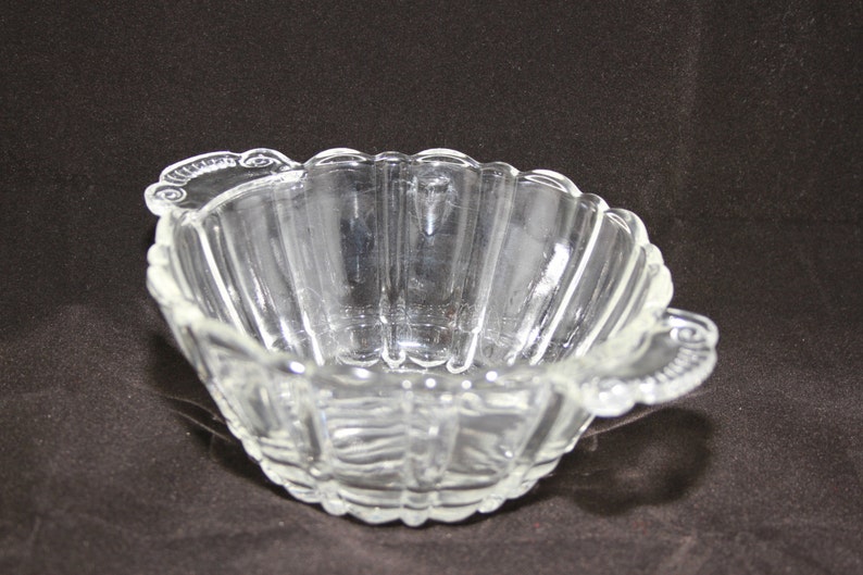 Vintage molded ribbed clear glass bowlcandy dish with decorative handles and scalloped edges