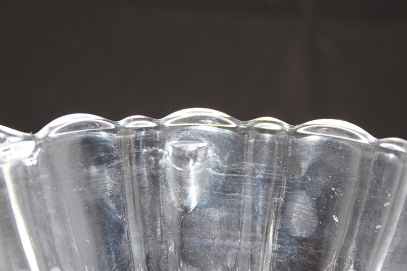 Vintage molded ribbed clear glass bowlcandy dish with decorative handles and scalloped edges