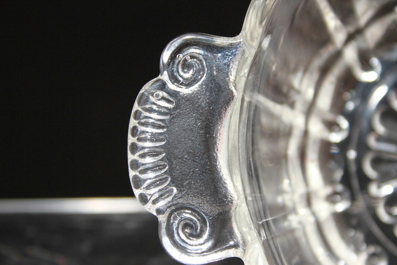 Vintage molded ribbed clear glass bowlcandy dish with decorative handles and scalloped edges