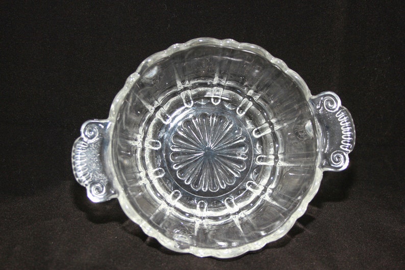 Vintage molded ribbed clear glass bowlcandy dish with decorative handles and scalloped edges