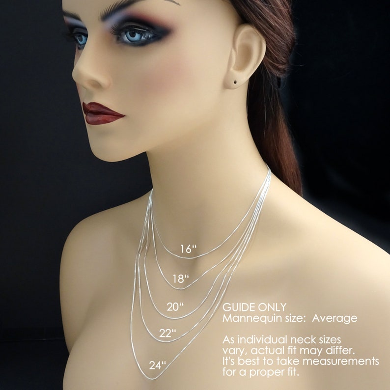 May include: A guide to necklace lengths, showing five silver chains on a mannequin, labelled 16 inches, 18 inches, 20 inches, 22 inches, and 24 inches.  "GUIDE ONLY Mannequin size: Average As individual neck sizes vary, actual fit may differ. It's best to take measurements for a proper fit."