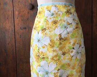 Summer everyday skirt made from 70's repurposed sheets with new cotton lining. Floral print in yellow, pale greens, blue and white.