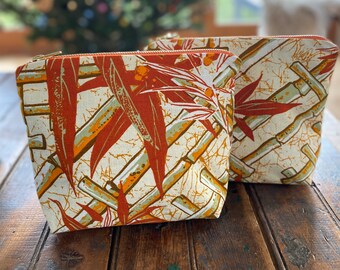 The Bigger cosmetic toiletries bag 10x8 inches from upcycled vintage fabrics with new metal zipper. Palm print vintage upholstery fabric.
