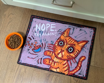 NOPE. TRY AGAIN!!  High quality artist created cat feeding mat.