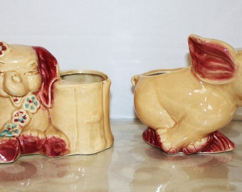 2 cute vintage elephant planters in matching colors. They are 60's maroon and pale gold. Perfect for small plant and children's room.