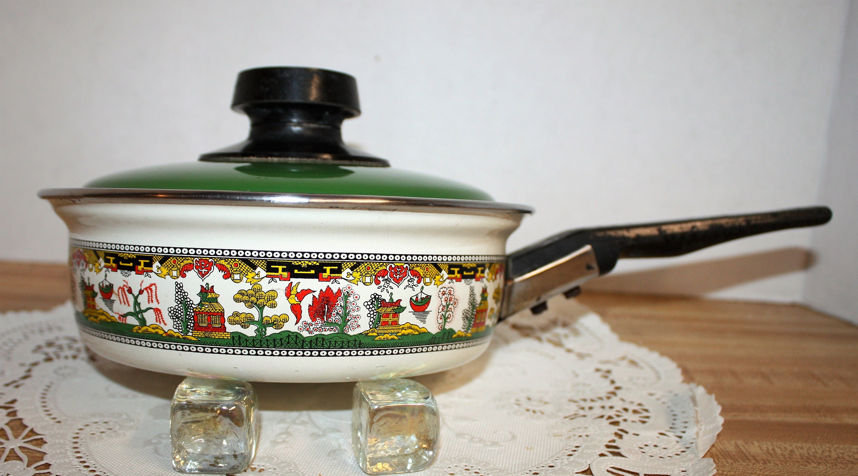 Small Kelvinator enamelware frying pan with cover, colorful Asian design on beige with green lid, promotional item