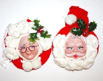 Hand made Santa and Mrs Claus plastic face wall or fridge decor, hand crocheted with plastic holly and magnets 9" tall