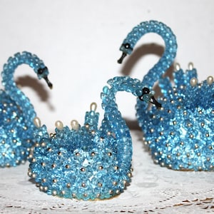 A flock of 3 blue pushpin beaded swans 70s or 80s retro decor, popular vintage craft project already completed