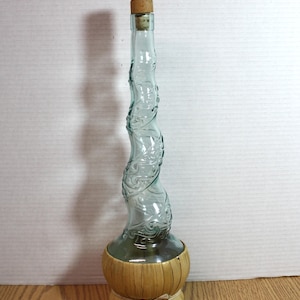 Chianti wine bottle with a curling twist neck and raffia woven bottom with the cork and wood stopper 16&quot; tall