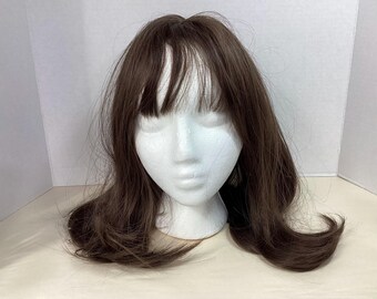 15 or 16 inch long with bangs new in original package synthetic brown
