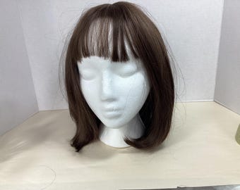 New wig in original packaging brown 13” bob with bangs