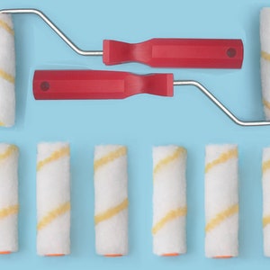 May include: Ten paint rollers with yellow and white striped patterns. The rollers are attached to red handles and silver extension poles.