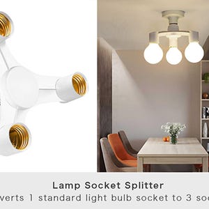 May include: White lamp socket splitter with three bulb sockets and gold-colored interiors. The text reads: "Lamp Socket Splitter. Converts 1 standard light bulb socket to 3 sockets."